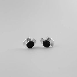 Pendientes elípticos de metal plateado con disco negro