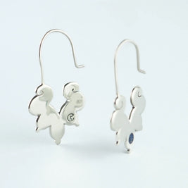 Pendientes colgantes de elefante en metal plateado con piedra azul